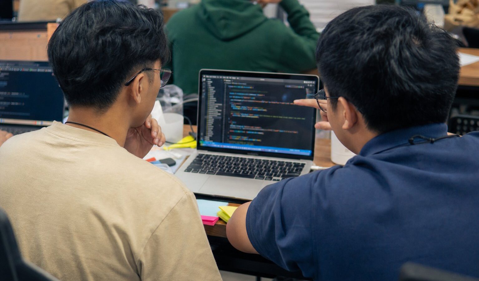 Developers pair-programming at a coding bootcamp in the Philippines